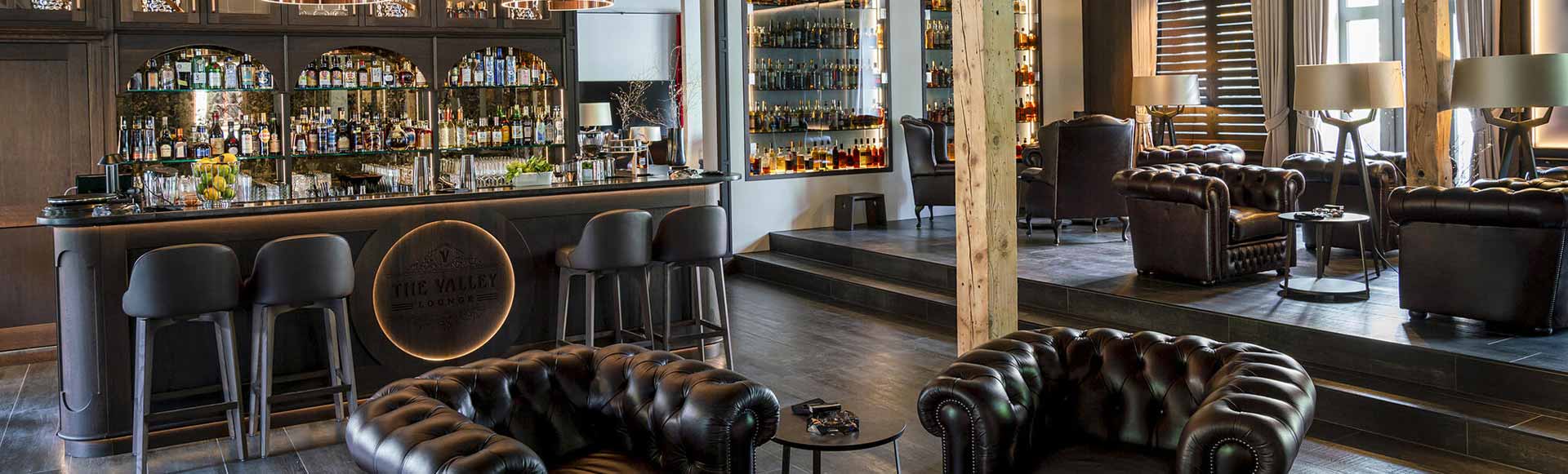 Elegant Lounge Setting with Seamless Commercial Laundry Equipment Integration