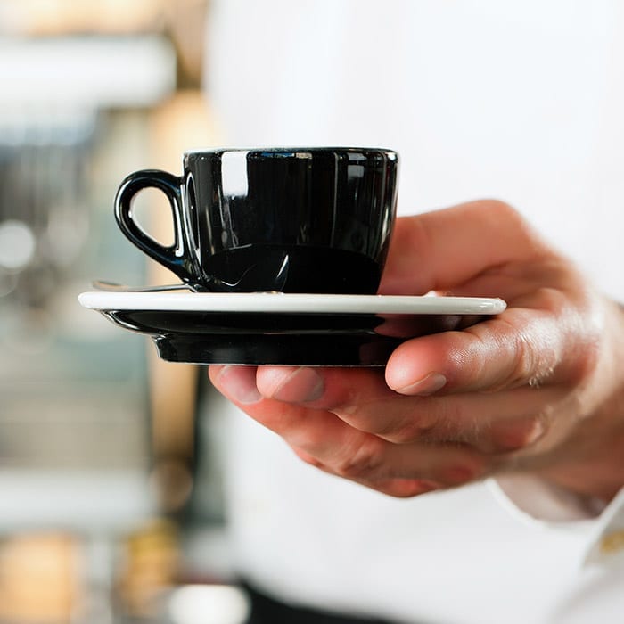 coffee grinders serving cup of coffee