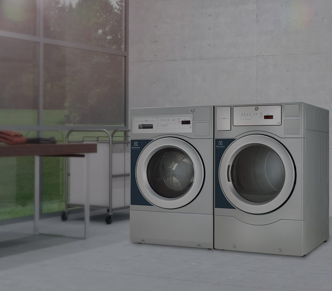 Dual Commercial Washer Machines near large windows