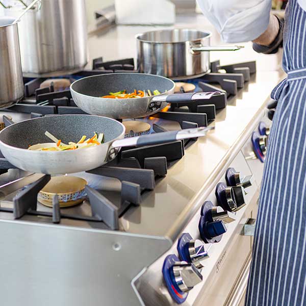 chef with various pans