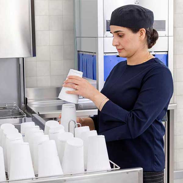 operator uses reusable cups