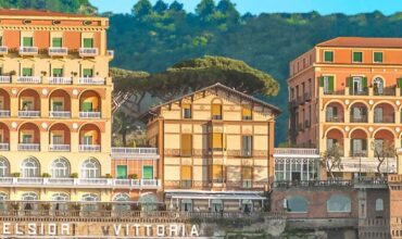 Exterior of Grand Hotel Excelsior Vittoria in Sorrento surrounded by and overlooking the sea