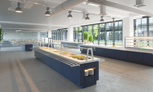 Modern cafeteria interior with long buffet counters displaying various dishes. Large windows let in natural light, offering a bright, welcoming ambiance.