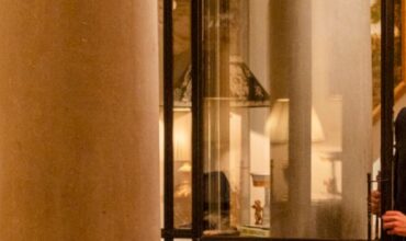 Elegant lobby of luxury hotel with uniformed staff and fine furnishings