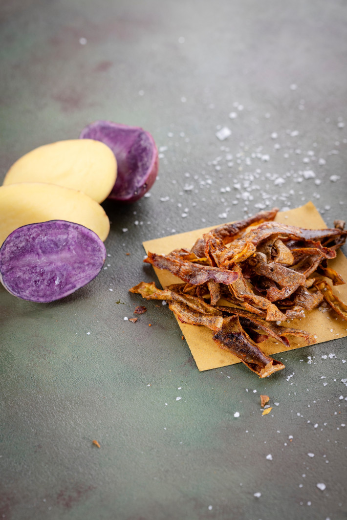 Zero waste potato peel chips with yellow and purple potatoes
