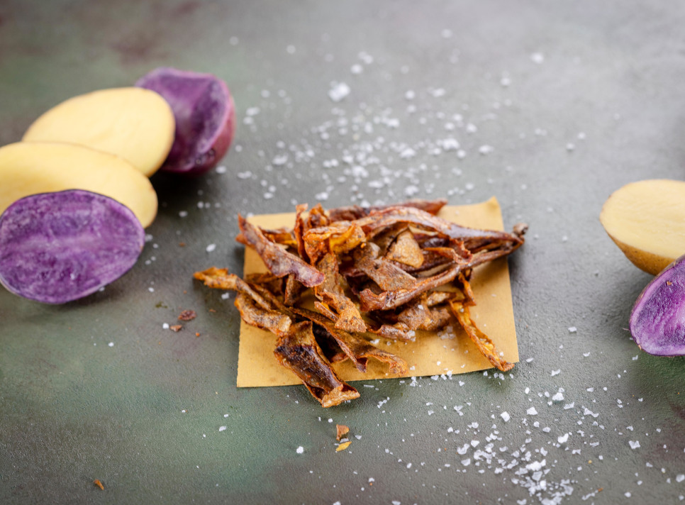 Zero waste potato peel chips with yellow and purple potatoes and salt